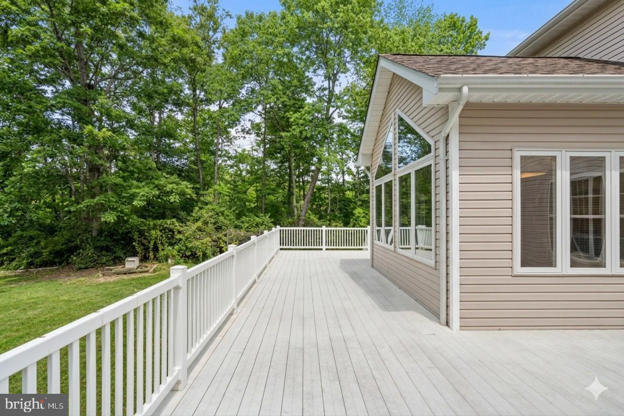 14760 Peach Tree Lane King George, VA 22485 - Photo 36 of 40 a view of a balcony with wooden floor and fence
