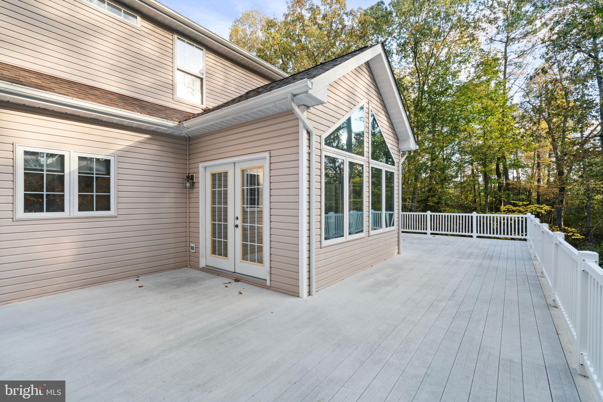 14760 Peach Tree Lane King George, VA 22485 - Photo 37 of 40 a view of a house with a wooden deck