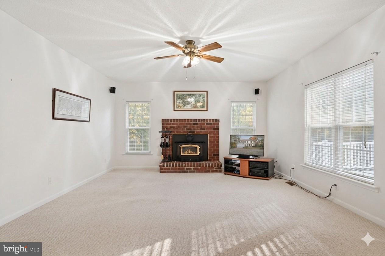 14760 Peach Tree Lane King George, VA 22485 - Photo 6 of 40 a living room with furniture and a fireplace
