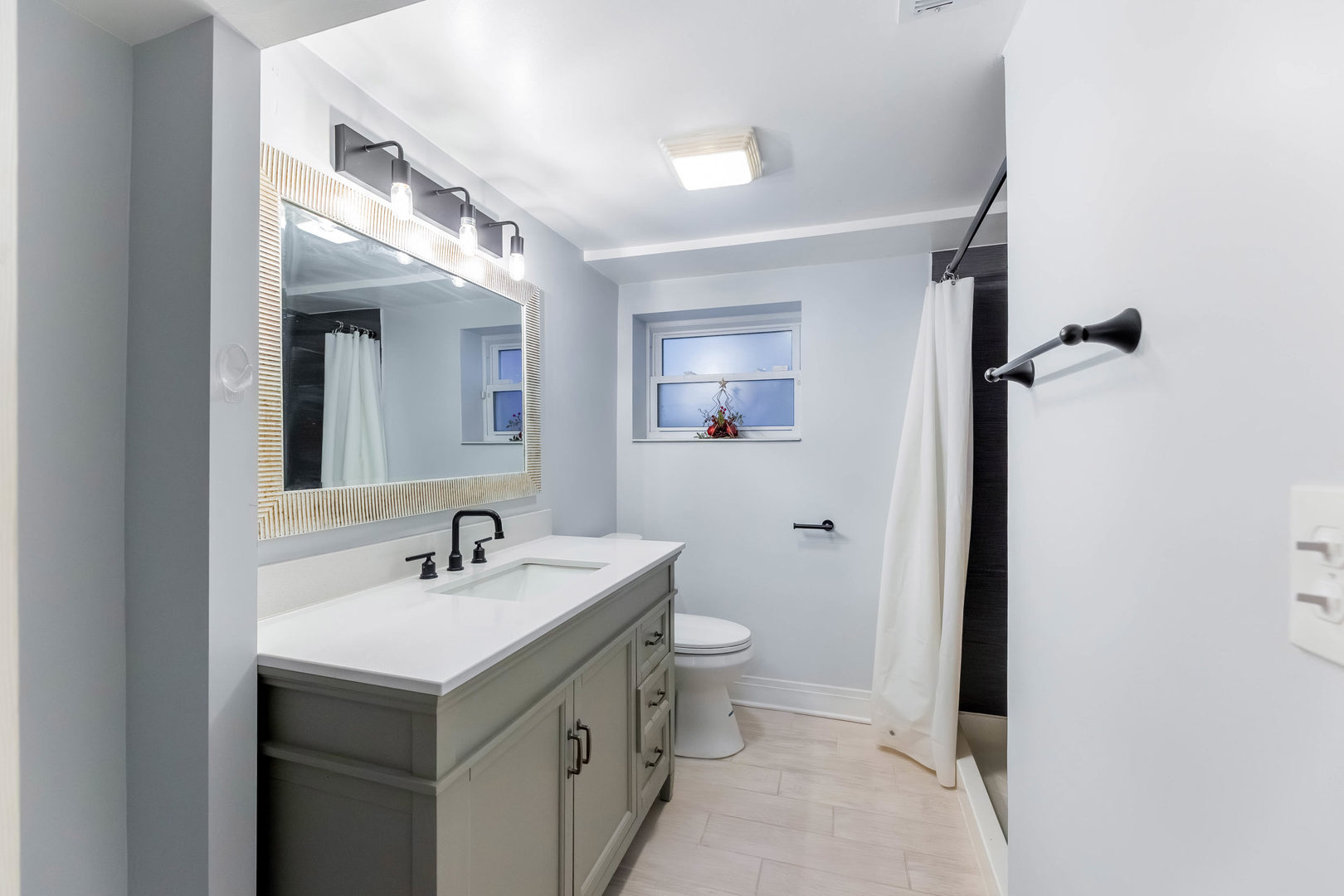 6358 South Keeler Avenue Chicago, IL 60629 - Photo 22 of 25 a bathroom with a sink and a mirror