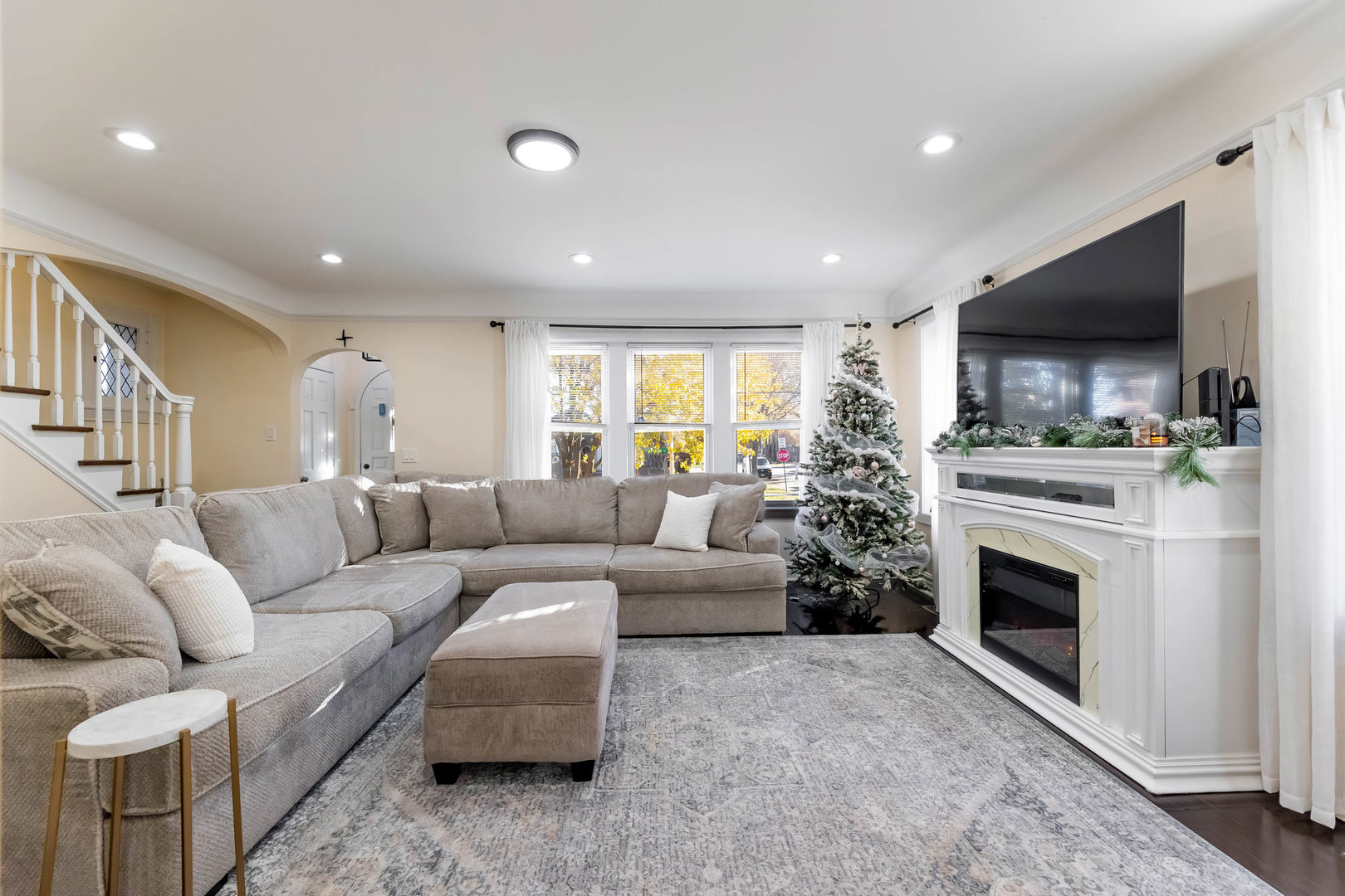 6358 South Keeler Avenue Chicago, IL 60629 - Photo 3 of 25 a living room with furniture a flat screen tv and a fireplace