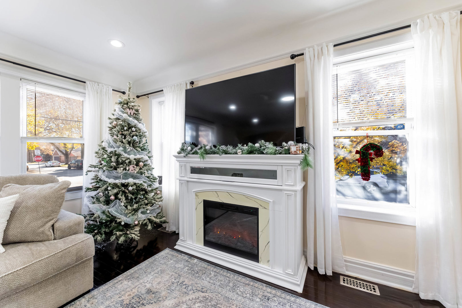 6358 South Keeler Avenue Chicago, IL 60629 - Photo 4 of 25 a living room with a fireplace and a large window