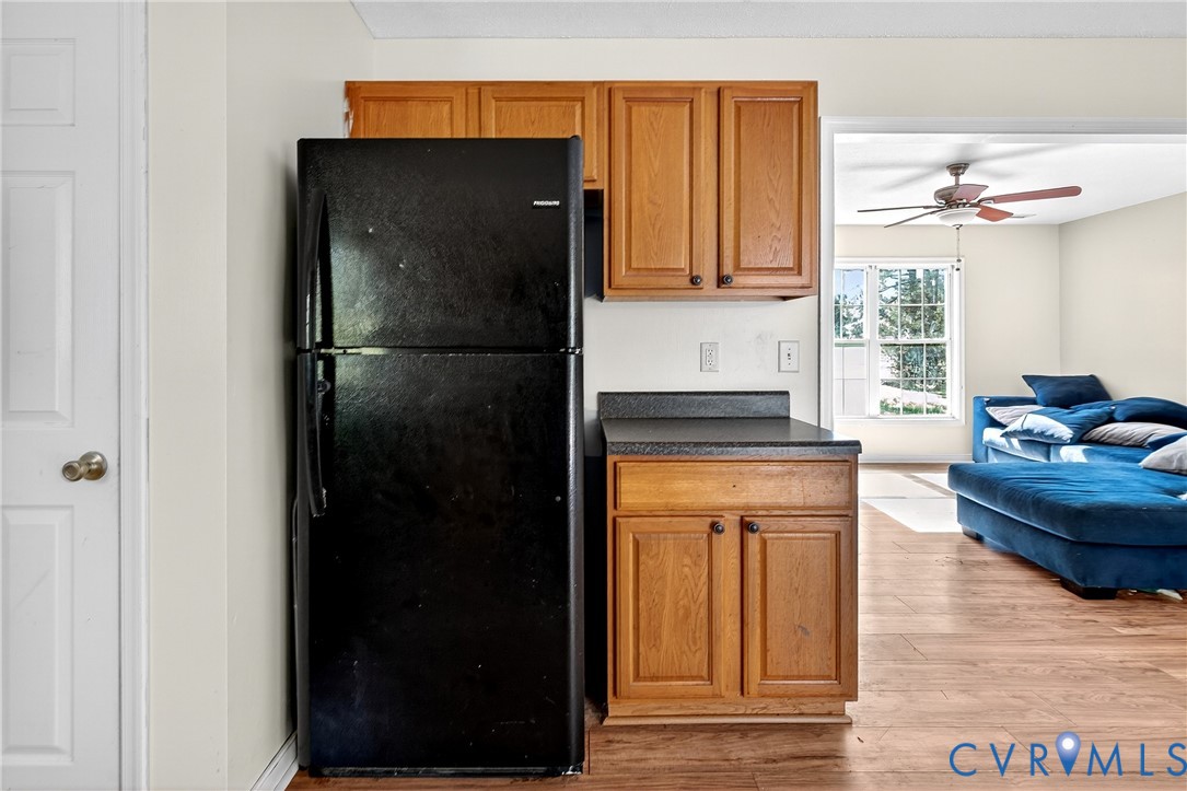 1611 Howerton Road Dunnsville, VA 22454 - Photo 14 of 36 a kitchen with stainless steel appliances granite countertop a refrigerator and a stove top oven