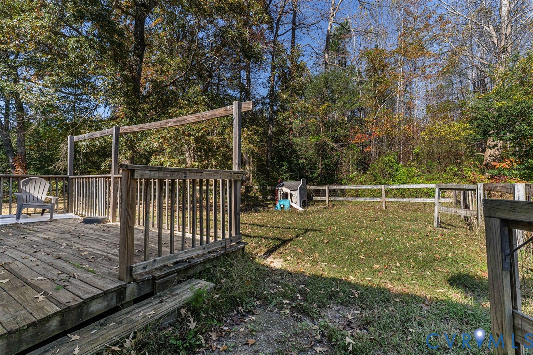 1611 Howerton Road Dunnsville, VA 22454 - Photo 23 of 36 a view of a backyard with fence