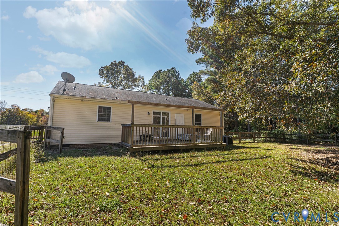 1611 Howerton Road Dunnsville, VA 22454 - Photo 24 of 36 a view of a house with a yard