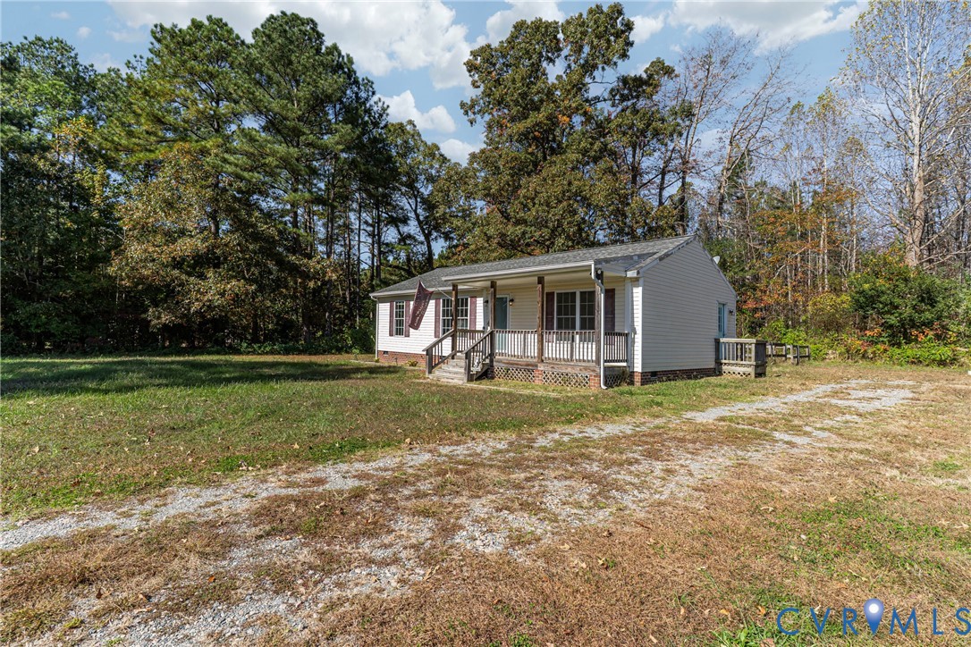 1611 Howerton Road Dunnsville, VA 22454 - Photo 33 of 36 a front view of house with yard and green space