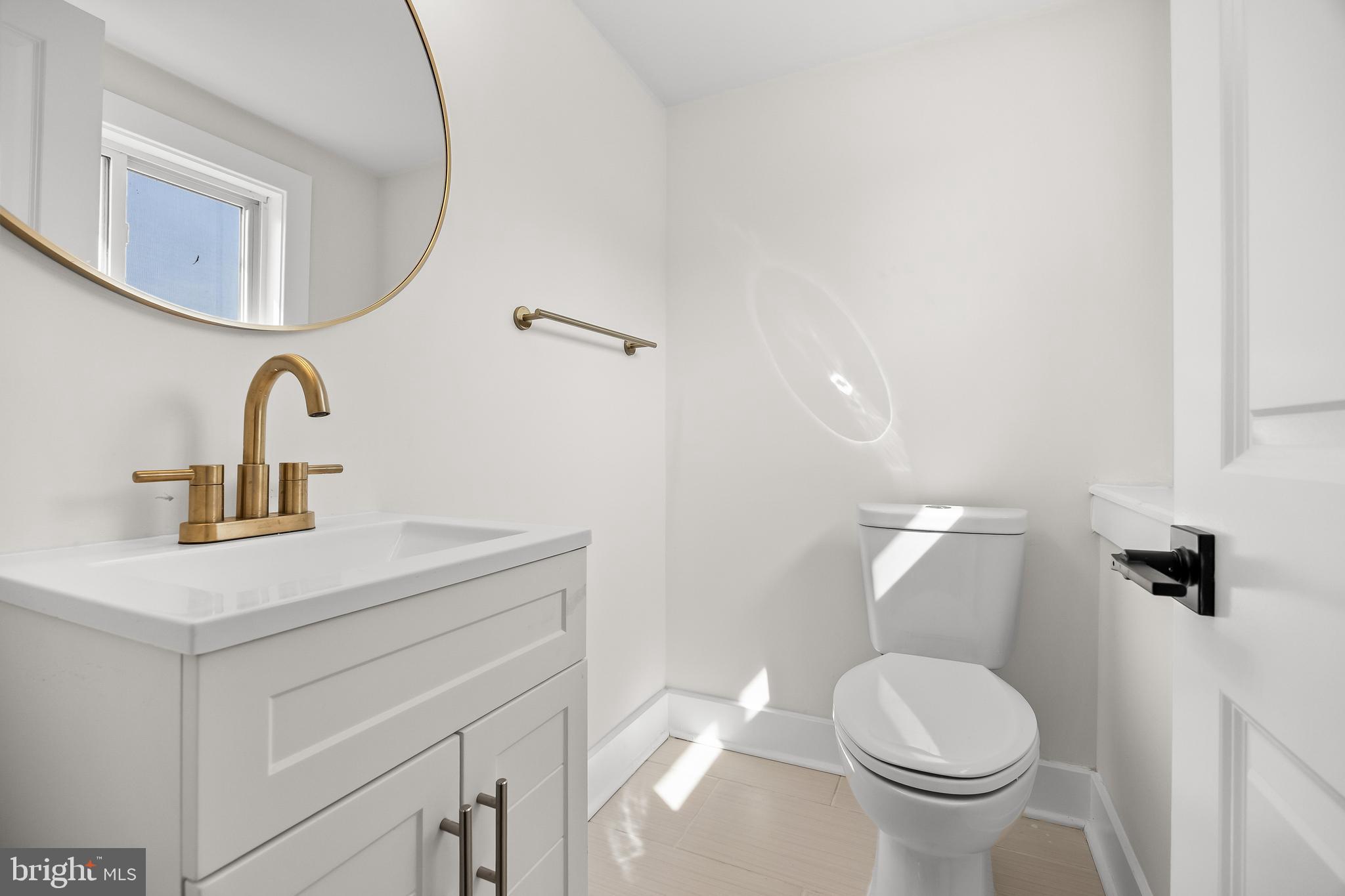 10 Cobblestone Road Cherry Hill, NJ 08003 - Photo 15 of 15 a bathroom with a sink a toilet and mirror