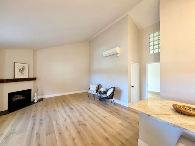 a bedroom with a bed and a fireplace