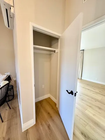 a view of a room with wooden floor and balcony