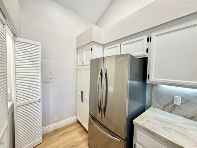 a bathroom with a double vanity sink and a shower