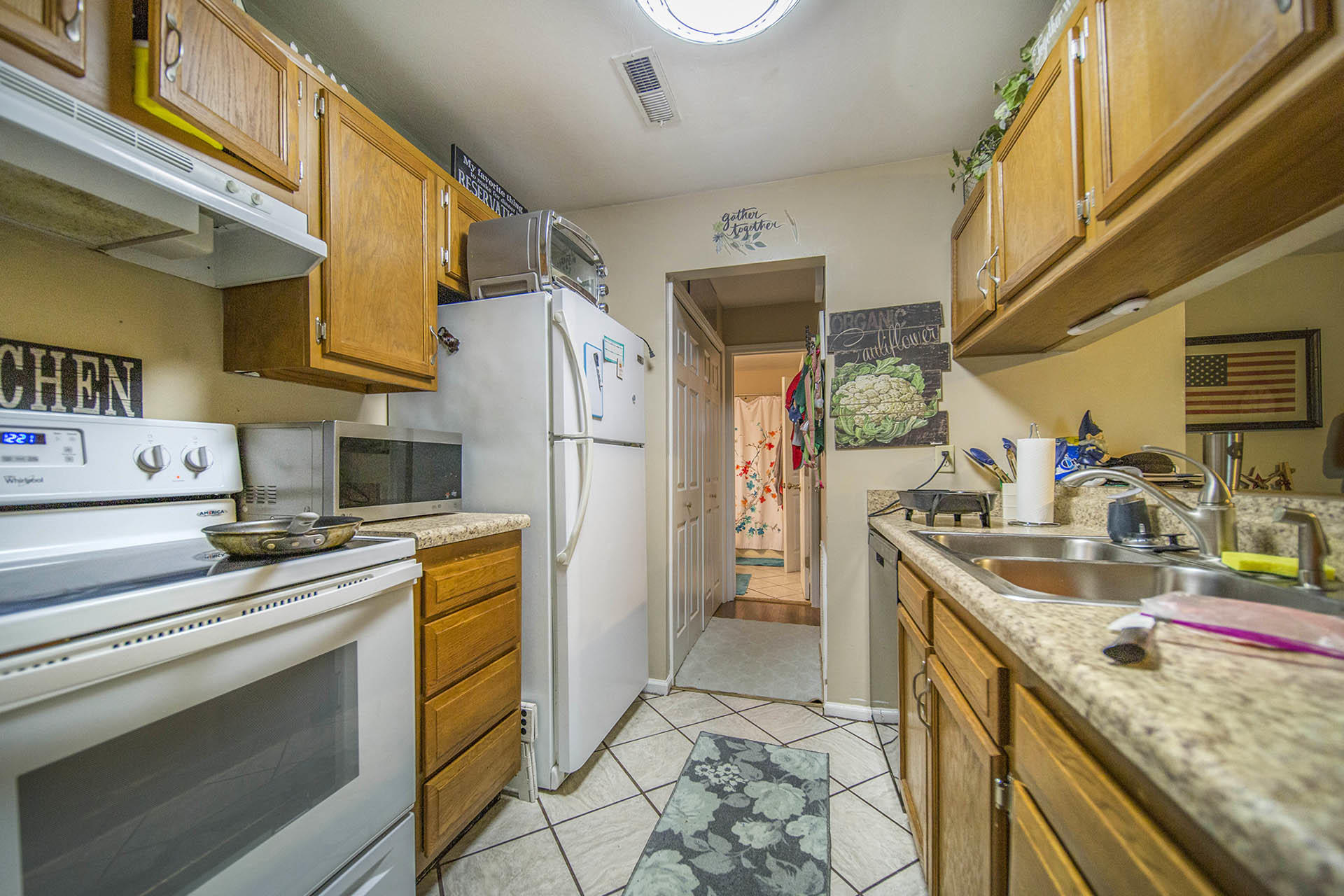 3353 Forest Ridge Road Roanoke, VA 24018 - Photo 10 of 12 a kitchen with stainless steel appliances granite countertop a sink stove and refrigerator