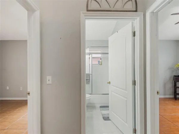 a view of a hallway with a chandelier