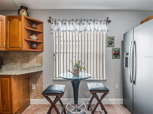a kitchen with stainless steel appliances granite countertop a sink and cabinets