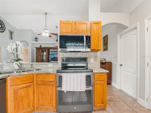 a kitchen with a table and chairs in it