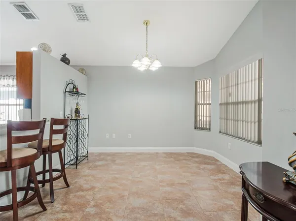 a view of a livingroom with furniture and a ceiling fan