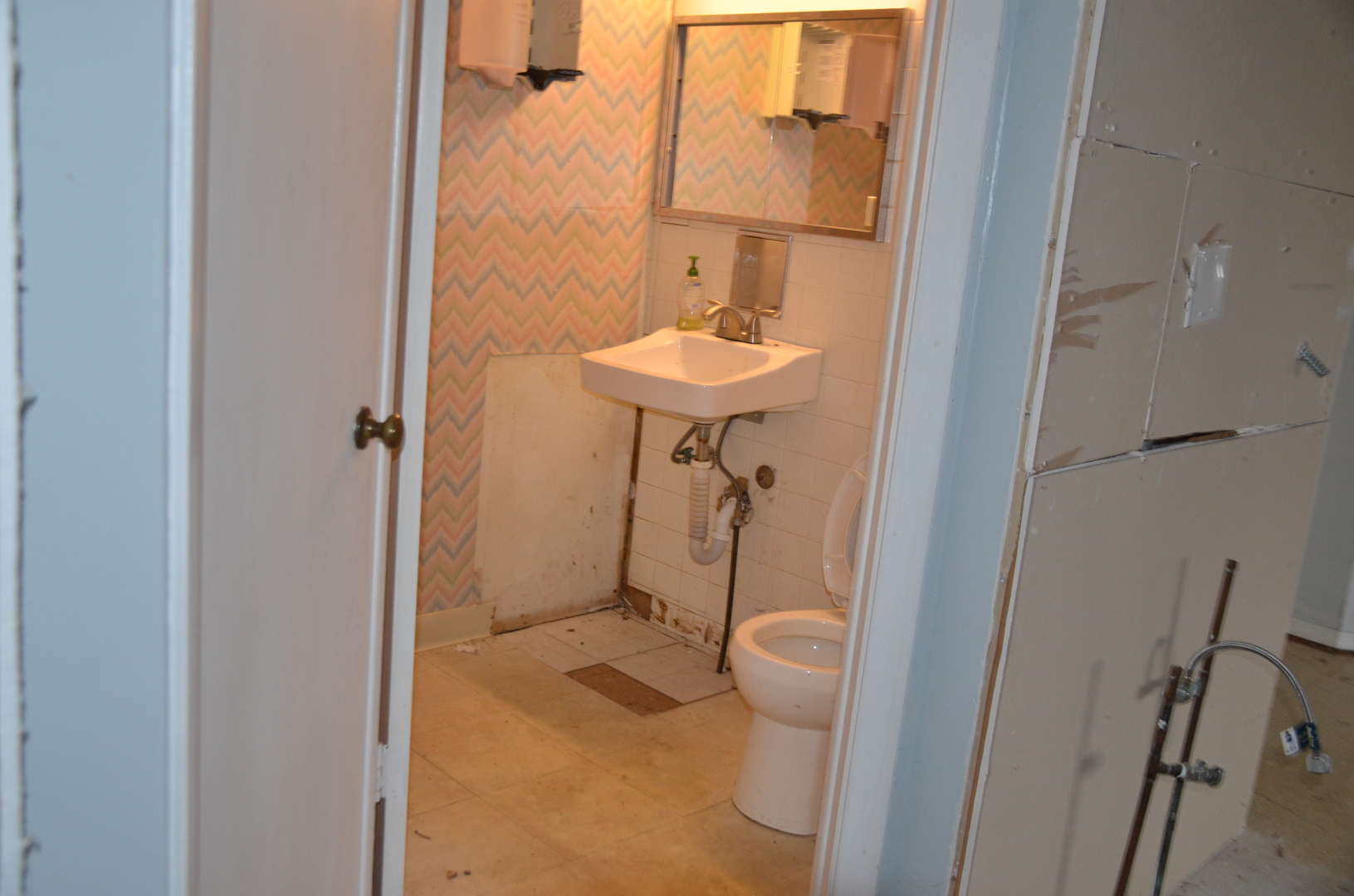 1225 Plainfield Road Darien, IL 60561 - Photo 4 of 14 a bathroom with a toilet and a sink