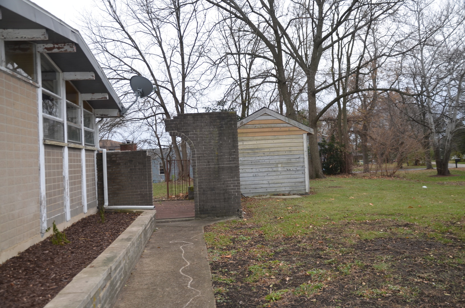 1225 Plainfield Road Darien, IL 60561 - Photo 7 of 14 a front view of a house with a yard