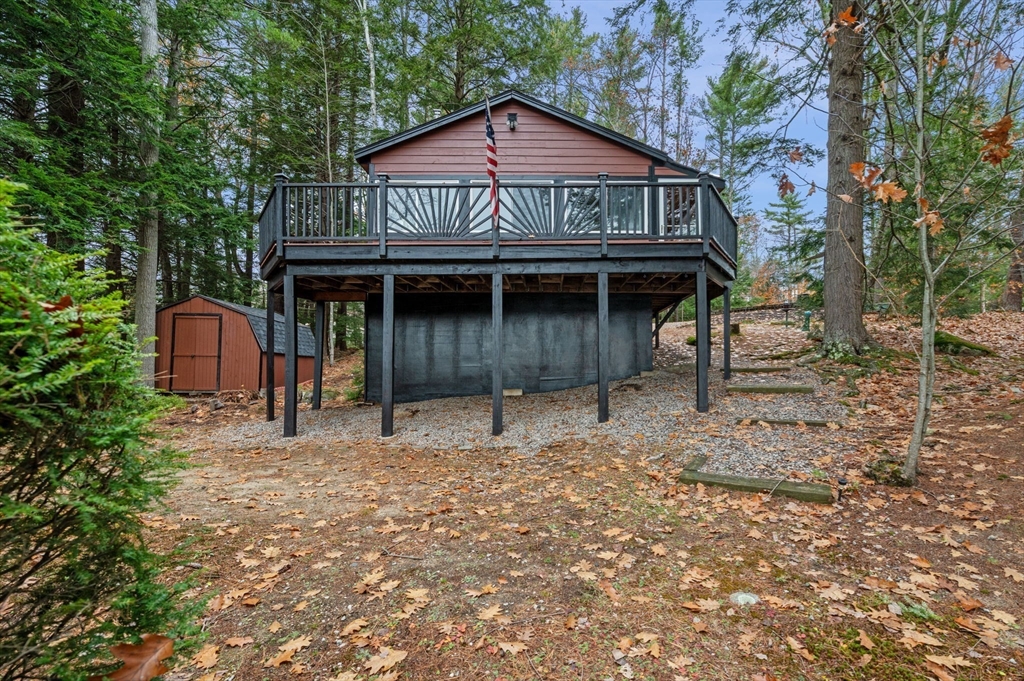 288 Pinkham Road Middleton, NH 03887 - Photo 2 of 42 a view of a house with a yard balcony and wooden fence