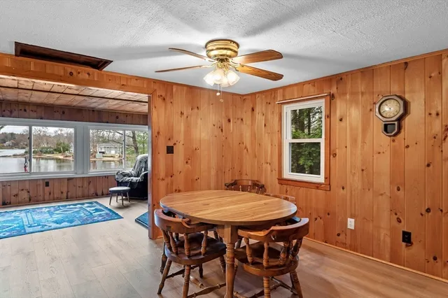 a dining room with a table and chairs