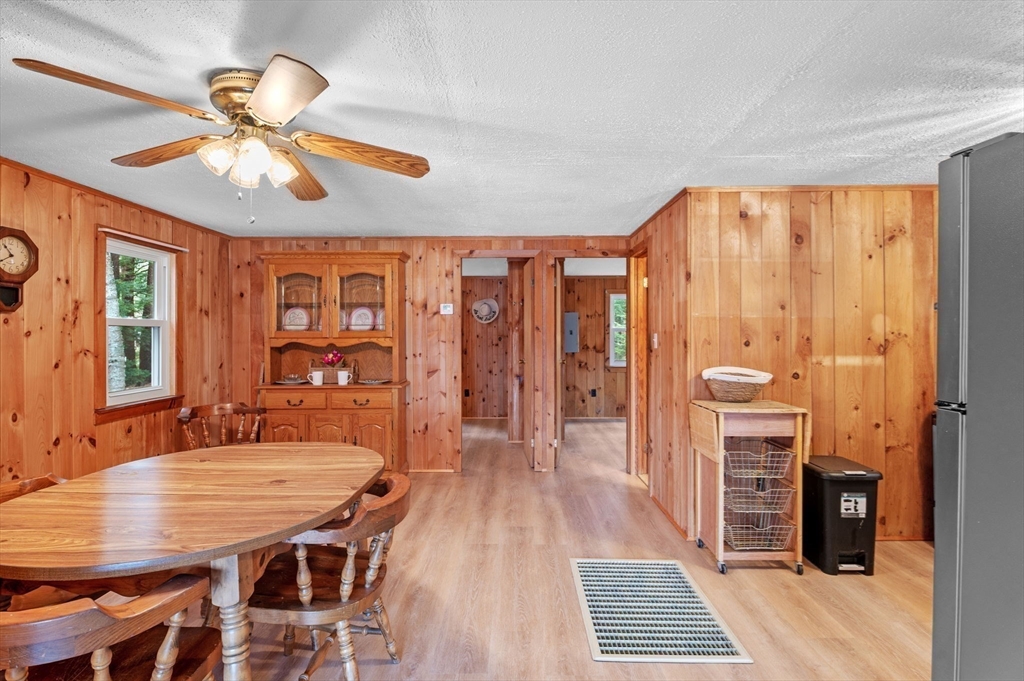288 Pinkham Road Middleton, NH 03887 - Photo 29 of 42 a view of a dining room with furniture window and wooden floor