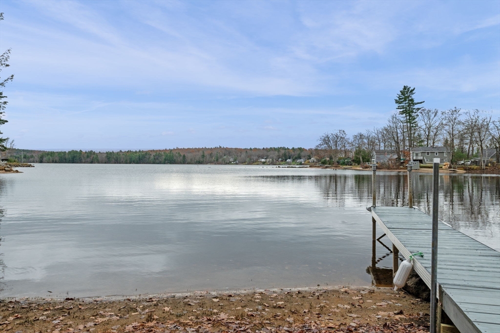 288 Pinkham Road Middleton, NH 03887 - Photo 3 of 42 a view of a lake with a city skyline in the background