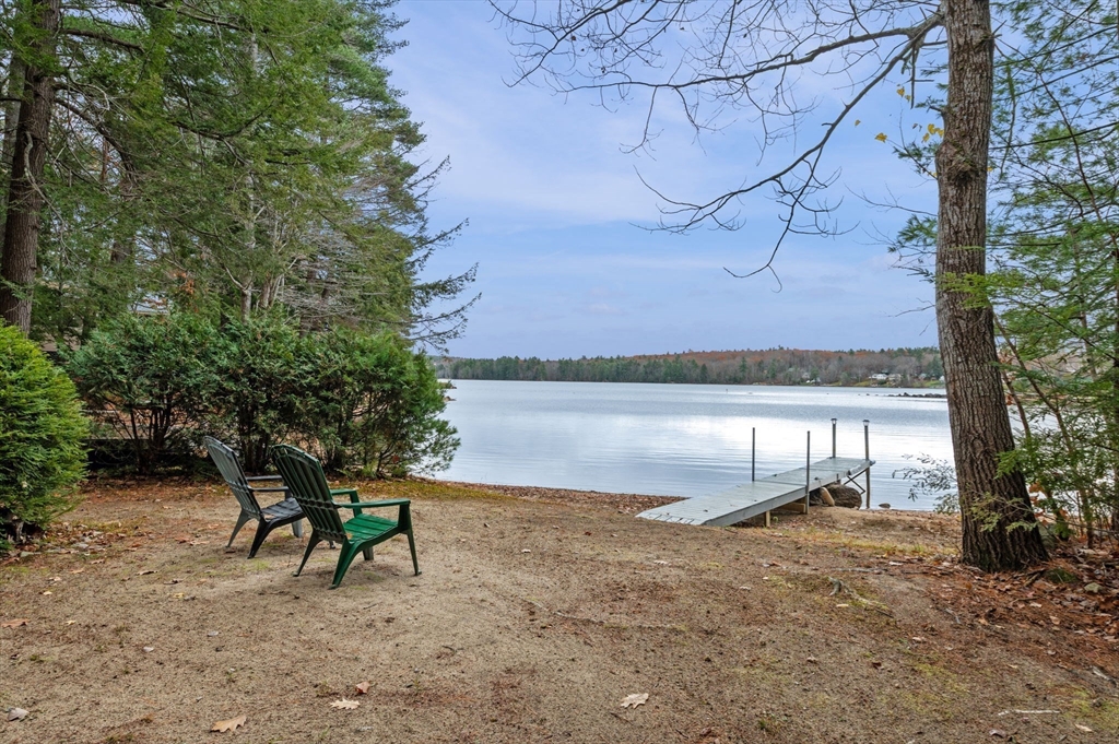 288 Pinkham Road Middleton, NH 03887 - Photo 5 of 42 a backyard of a house with table and chairs