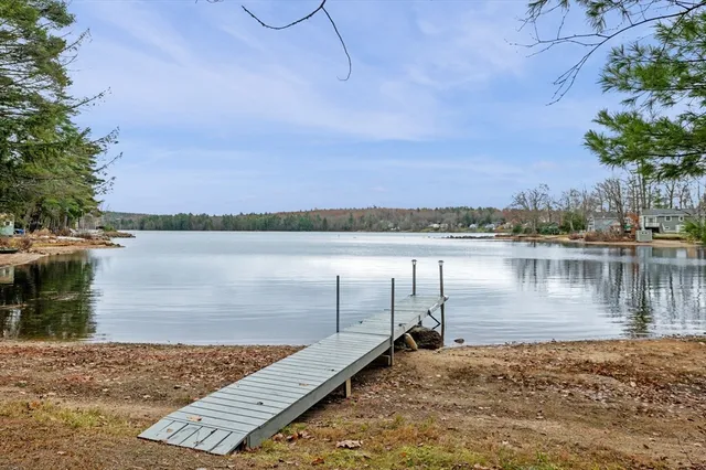 a view of a lake with houses in the back