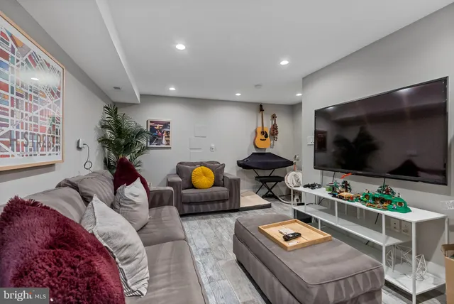 a hallway view with furniture and view of bedroom