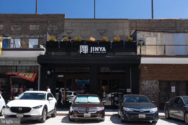 a front view of a building with street view