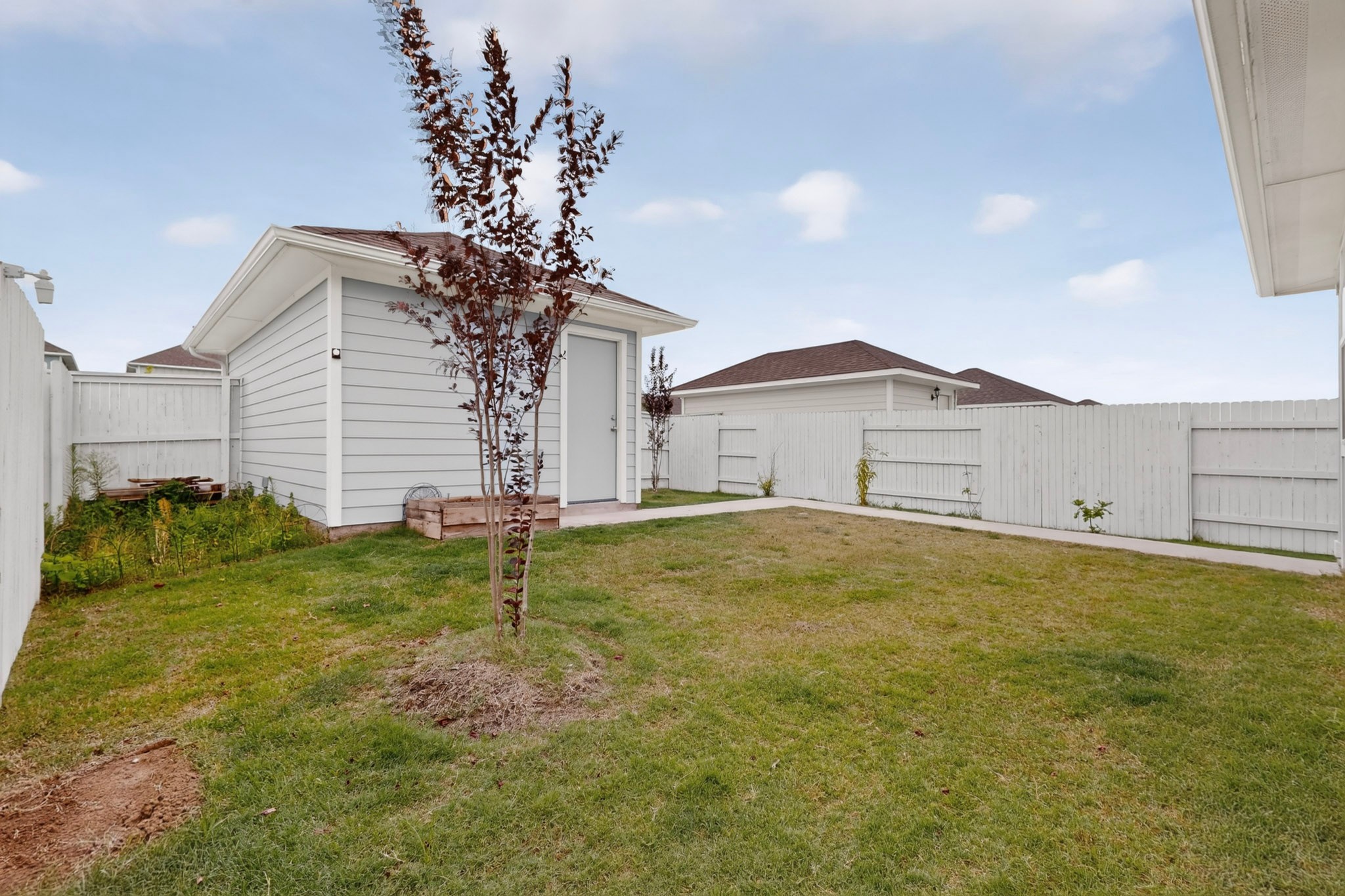116 Appleberry Lane Elgin, TX 78621 - Photo 35 of 35 A detached shed and private yard offers additional outdoor utility and storage.