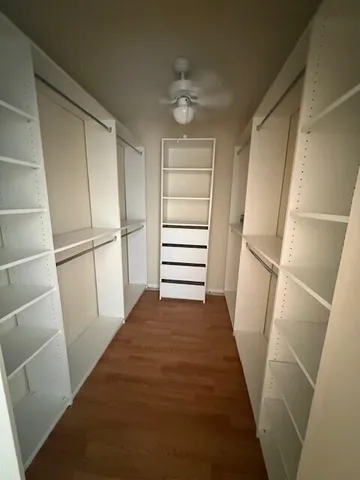 an empty room with a empty space and windows