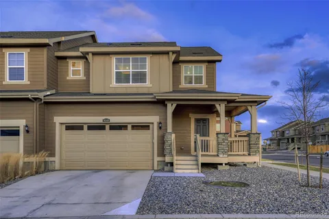 a front view of a house with garage