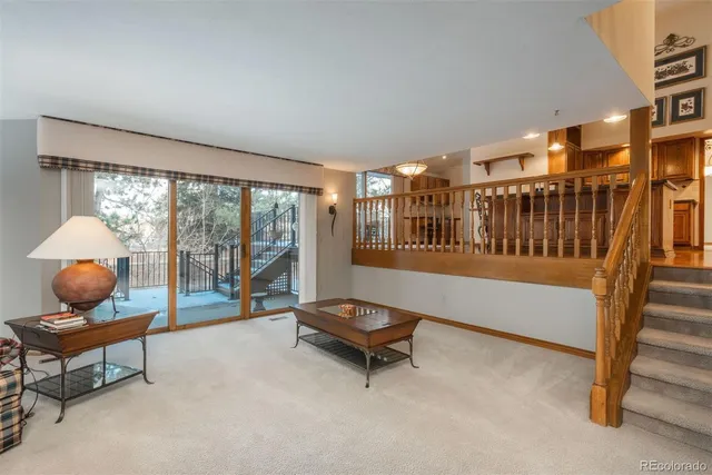 a room with stairs and a chandelier