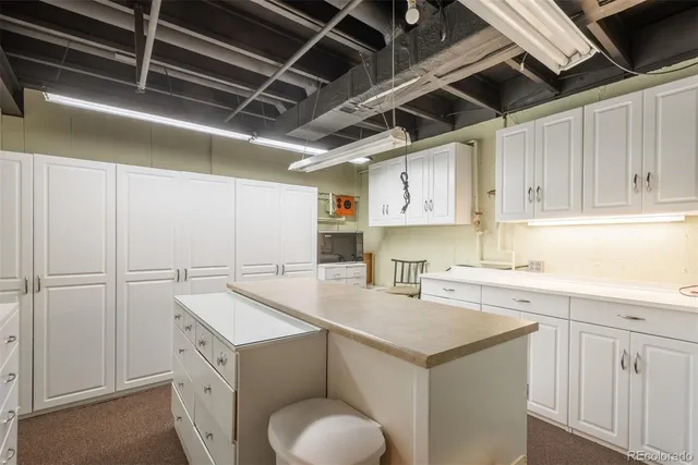 a view of a patio with table and chairs and potted plants
