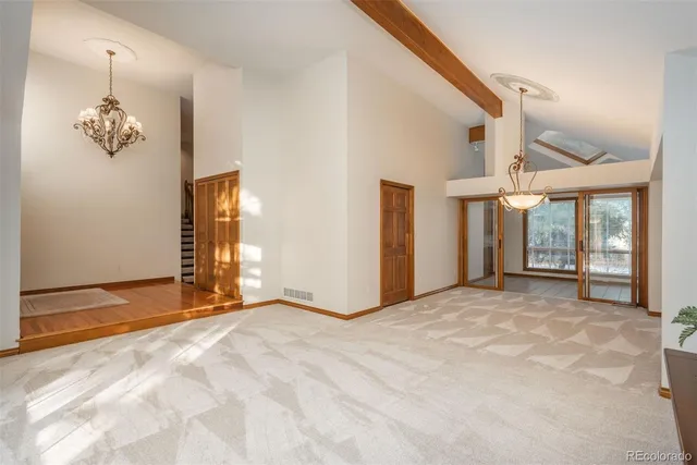 a view of an empty room with a fireplace