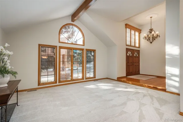 a view of a room with furniture and a window