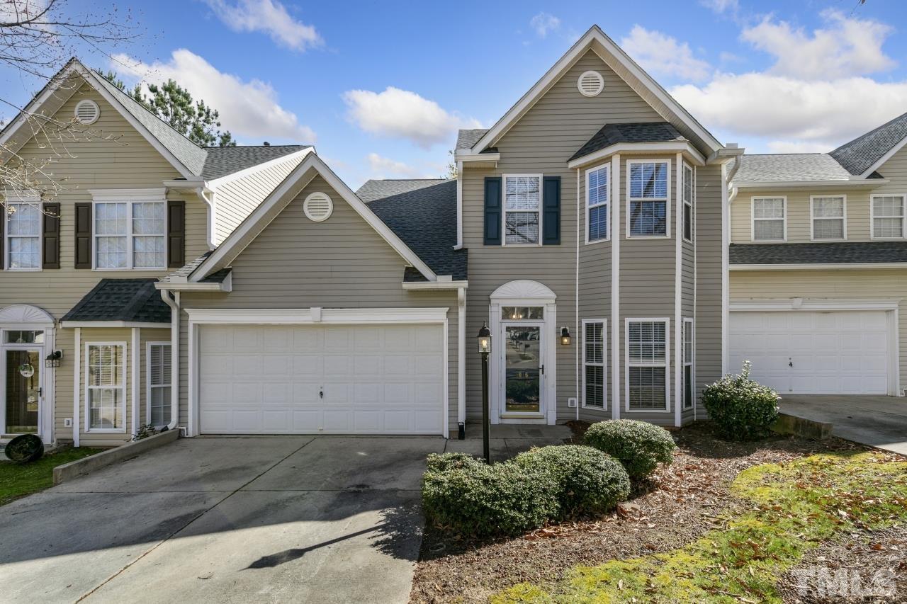 1016 Garnet Ridge Way Raleigh, NC 27607 - Photo 1 of 38 a front view of a house with a yard and garage