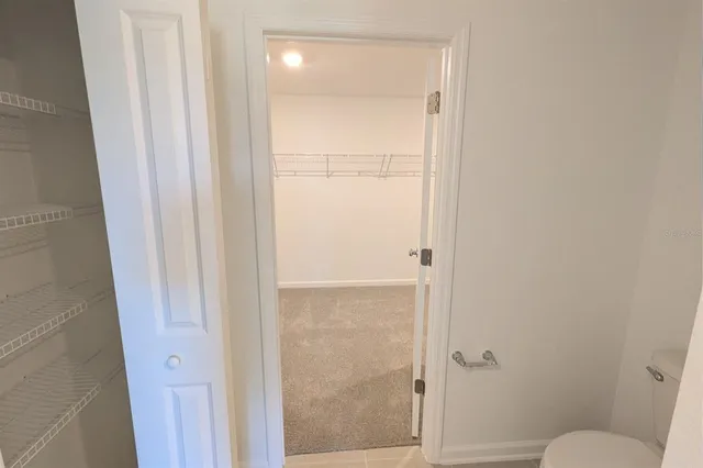 a bathroom with a glass door shower