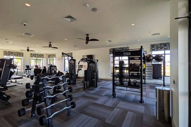 a view of a room with lots of wooden furniture