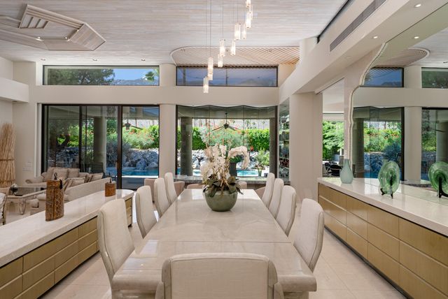 a kitchen with stainless steel appliances granite countertop a refrigerator and a stove