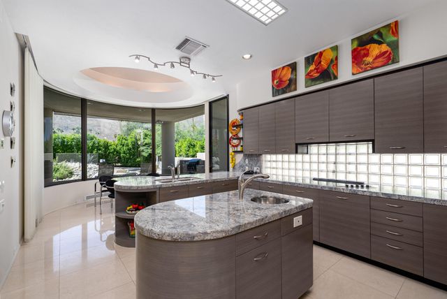 a bedroom with furniture and a flat screen tv