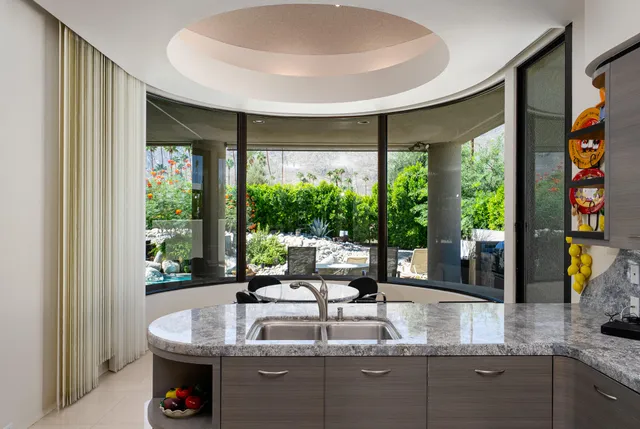 a bathroom with a tub sink shower and mirror