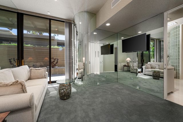 a view of a backyard with plants and a patio