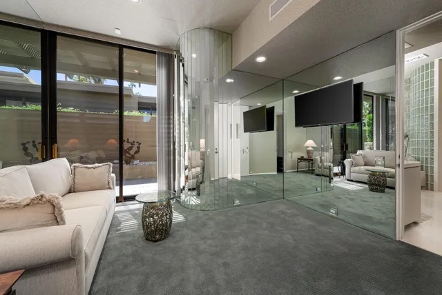 a view of a backyard with plants and a patio