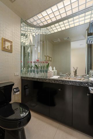 a dining room with furniture and a potted plant