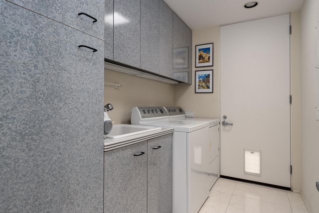 a view of a chairs and table in patio