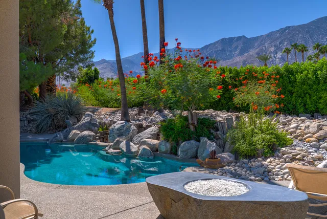 a view of a chairs and table in the patio
