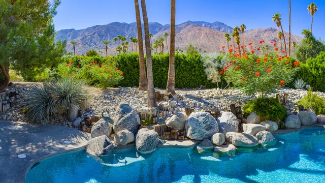 a building outdoor space with patio furniture and potted plants