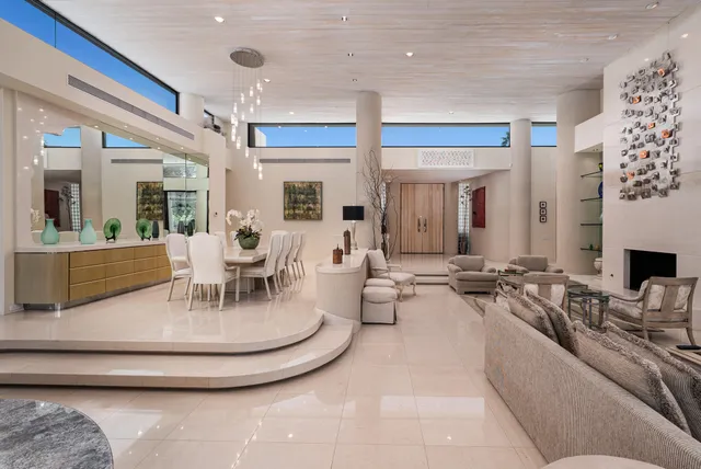 a living room with furniture wooden floor and a flat screen tv