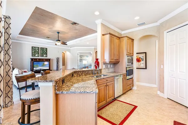 a kitchen with stainless steel appliances granite countertop a stove and a refrigerator